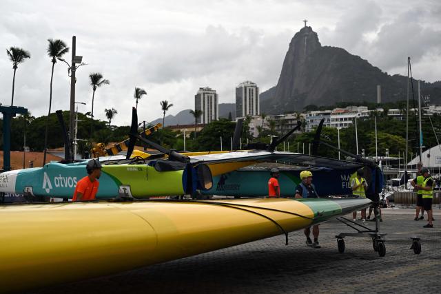 Crew members prepare to lift the wing of the Mubadala Brazil SailGP team vessel at Rio de Janeiro Yacht Club, during the Rio 2026 SailGP in Rio de Janeiro, Brazil, on April 10, 2026. (Photo by Mauro PIMENTEL / AFP)