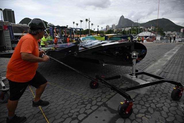 Crew members prepare to lift the wing of the Mubadala Brazil SailGP team vessel at Rio de Janeiro Yacht Club, during the Rio 2026 SailGP in Rio de Janeiro, Brazil, on April 10, 2026. (Photo by Mauro PIMENTEL / AFP)