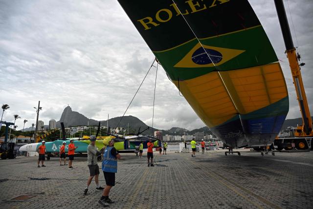Crew members prepare to lift the wing of the Mubadala Brazil SailGP team vessel at Rio de Janeiro Yacht Club, during the Rio 2026 SailGP in Rio de Janeiro, Brazil, on April 10, 2026. (Photo by Mauro PIMENTEL / AFP)