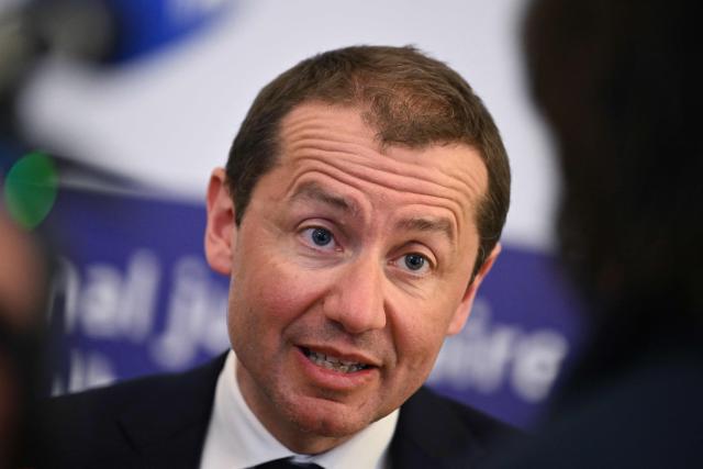 Mulhouse Public Prosecutor Nicolas Heitz speaks to the press after a boy was discovered naked and malnourished on a pile of rubbish in a van where he had been kept locked up, in Hagenbach, eastern France, on April 10, 2026. Gendarmes discovered the child on April 6, 2026, after being alerted by a local resident who had heard “the sounds of a child” coming from a van parked in a resident's courtyard. The nine-year-old endured a nightmare for over a year in the small village of southern Alsace, according to the public prosecutor in Mulhouse, who announced on April 10 that the boy’s father and his partner had been charged. (Photo by SEBASTIEN BOZON / AFP)