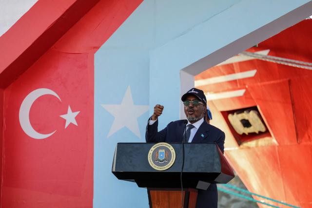 Somalia's President Hassan Sheikh Mohamud speaks during the launch of an offshore energy exploration at th eport in Mogadishu on April 10, 2026. A Turkish drilling ship docked at the port of Mogadishu on April 10, 2026 ahead of Somalia's first offshore oil drilling project, the two countries announced.
A hydrocarbon development deal signed in 2024 granted Turkey's state-owned energy company the right to explore three offshore blocks of around 5,000 square kilometres (1,900 square miles) each.
The Cagri Bey, featuring a red bow emblazoned with a white star and crescent and topped by a drilling derrick, arrived in Somali waters on April 9, 2026 and docked in the capital's port a day later. (Photo by Hassan Ali ELMI / AFP)