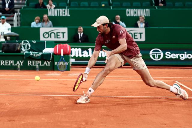 Monaco's Valentin Vacherot plays a drop shot against Australia's Alex De Minaur during the Monte Carlo ATP Masters Series Tournament quarter final tennis match on Court Rainier III at the Monte-Carlo Country Club in Roquebrune-Cap-Martin, south-eastern France on April 10, 2026. (Photo by Thibaud MORITZ / AFP)