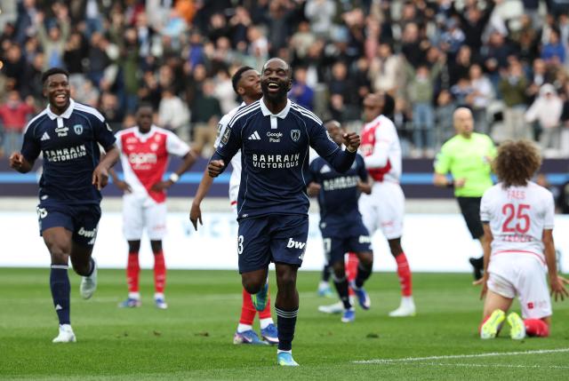 Paris FC's French midfielder #93 Jonathan Ikone (C) celebrates after scoring his second goal during the French L1 football match between Paris FC and AS Monaco at the Stade Jean-Bouin in Paris on April 10, 2026. (Photo by FRANCK FIFE / AFP)