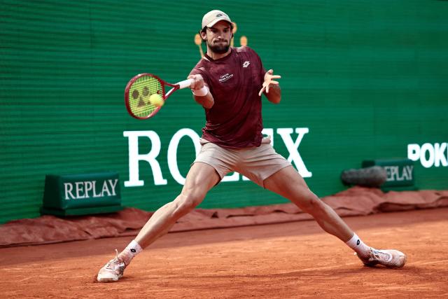 Monaco's Valentin Vacherot plays a forehand return to Australia's Alex De Minaur during the Monte Carlo ATP Masters Series Tournament quarter final tennis match on Court Rainier III at the Monte-Carlo Country Club in Roquebrune-Cap-Martin, south-eastern France on April 10, 2026. (Photo by Thibaud MORITZ / AFP)