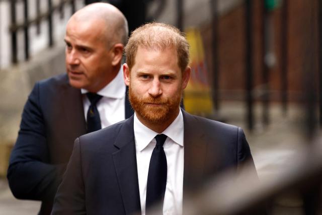 (FILES) Britain's Prince Harry arrives outside the High Court in London on January 20, 2026, for the second day of the trial in his case against a major UK newspaper group. An African AIDS charity co-founded by Prince Harry in honour of his mother Princess Diana is suing him for defamation, media reports said April 10, 2026, following a bitter internal dispute. (Photo by Brook Mitchell / AFP)