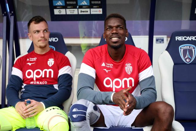 Monaco's French midfielder #08 Paul Pogba (R) sits on the bench during the French L1 football match between Paris FC and AS Monaco at the Stade Jean-Bouin in Paris on April 10, 2026. (Photo by FRANCK FIFE / AFP)
