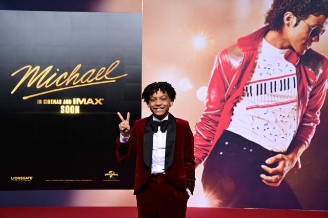 US young actor Juliano Valdi poses for photogaphers as he arrives on the red carpet for the world premiere of the Michael Jackson biopic "Michael" at the Uber Eats Music Hall in Berlin on April 10, 2026. Thousands of Michael Jackson fans converged on April 10, 2026 to Berlin before the world premiere of the biopic on the king of pop, despite the accusations of paedophilia that still target the artist. (Photo by John MACDOUGALL / AFP)