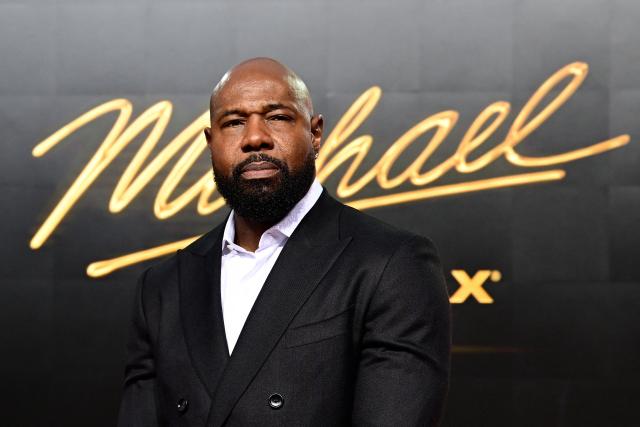 US director Antoine Fuqua poses for photogaphers as he arrives on the red carpet for the world premiere of the Michael Jackson biopic "Michael" at the Uber Eats Music Hall in Berlin on April 10, 2026. Thousands of Michael Jackson fans converged on April 10, 2026 to Berlin before the world premiere of the biopic on the king of pop, despite the accusations of paedophilia that still target the artist. (Photo by John MACDOUGALL / AFP)