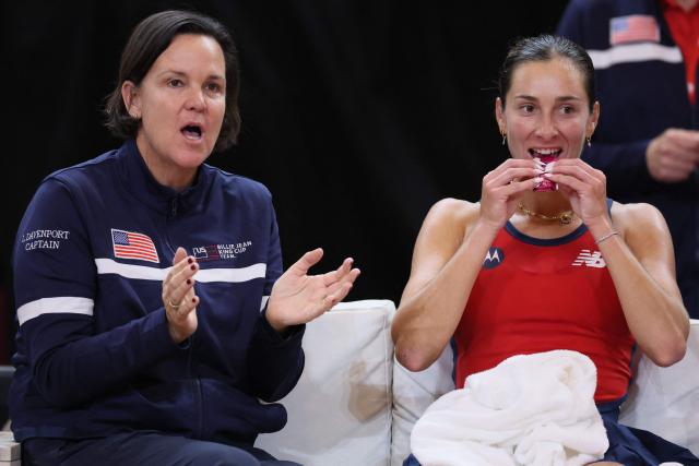 USA's team captain Lindsay Davenport (L) reacts flanked by USA's McCartney Kessler (R) during her women's singles match against Belgium's Elise Mertens of the Billie Jean King Cup play-offs between Belgium and USA in Ostend on April 10, 2026. (Photo by BENOIT DOPPAGNE / Belga / AFP) / Belgium OUT