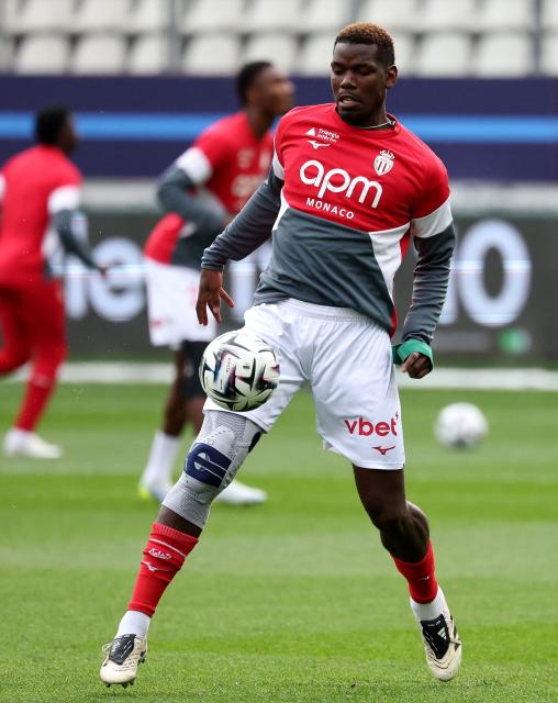 Monaco's French midfielder #08 Paul Pogba warms up ahead of the French L1 football match between Paris FC and AS Monaco at the Stade Jean-Bouin in Paris on April 10, 2026. (Photo by FRANCK FIFE / AFP)