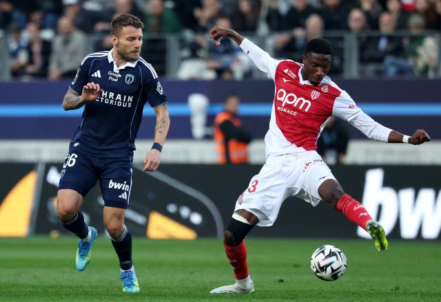 Monaco's French midfielder #23 Aladji Bamba (R) fights for the ball with Paris FC's Italian forward #36 Ciro Immobile during the French L1 football match between Paris FC and AS Monaco at the Stade Jean-Bouin in Paris on April 10, 2026. (Photo by FRANCK FIFE / AFP)