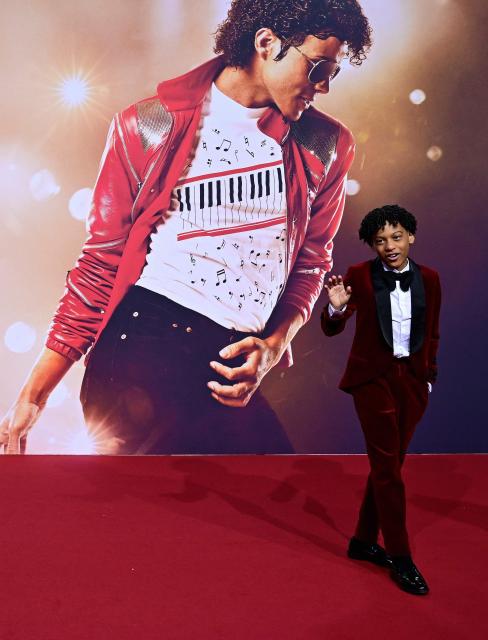 US young actor Juliano Valdi poses for photogaphers as he arrives on the red carpet for the world premiere of the Michael Jackson biopic "Michael" at the Uber Eats Music Hall in Berlin on April 10, 2026. Thousands of Michael Jackson fans converged on April 10, 2026 to Berlin before the world premiere of the biopic on the king of pop, despite the accusations of paedophilia that still target the artist. (Photo by John MACDOUGALL / AFP) / ALTERNATIVE CROP