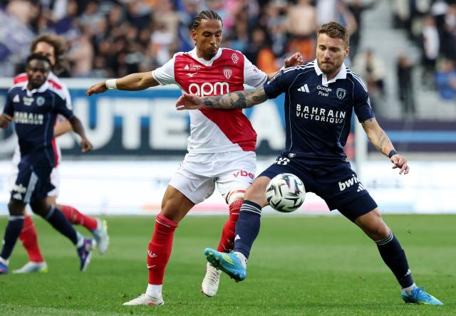 Monaco's German defender #05 Thilo Kehrer (L) fights for the ball with Paris FC's Italian forward #36 Ciro Immobile during the French L1 football match between Paris FC and AS Monaco (ASM) at Stade Jean Bouin in Paris on April 10, 2026. (Photo by FRANCK FIFE / AFP)