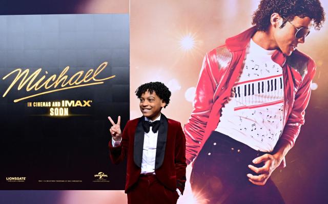 US young actor Juliano Valdi poses for photogaphers as he arrives on the red carpet for the world premiere of the Michael Jackson biopic "Michael" at the Uber Eats Music Hall in Berlin on April 10, 2026. Thousands of Michael Jackson fans converged on April 10, 2026 to Berlin before the world premiere of the biopic on the king of pop, despite the accusations of paedophilia that still target the artist. (Photo by John MACDOUGALL / AFP) / ALTERNATIVE CROP