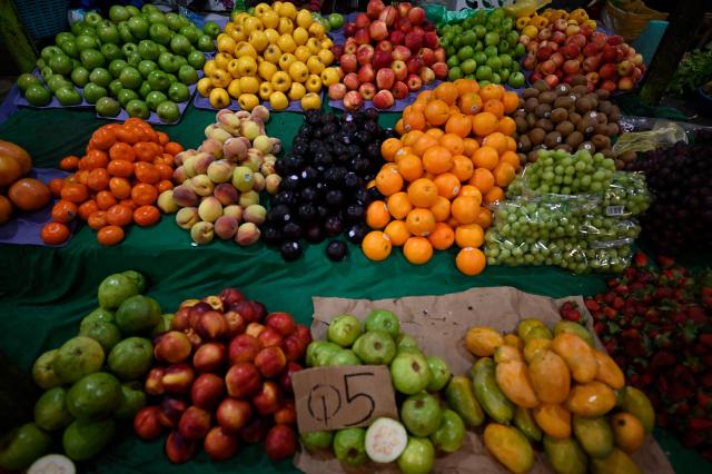 Fruits for sale are pictured at La Terminal market in Guatemala City on April 10, 2026. (Photo by JOHAN ORDONEZ / AFP)