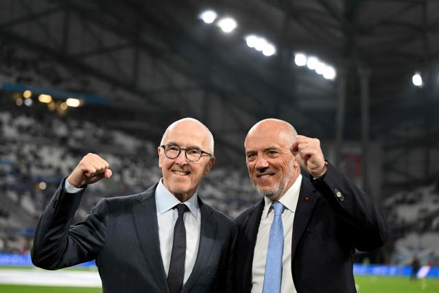 Marseille's newly appointed President Stephane Richard (R) and Marseille's US owner Frank McCourt pose prior the French L1 football match between Olympique de Marseille (OM) and FC Metz at the Stade Velodrome in Marseille, southern France, on April 10, 2026. (Photo by Gabriel BOUYS / AFP)