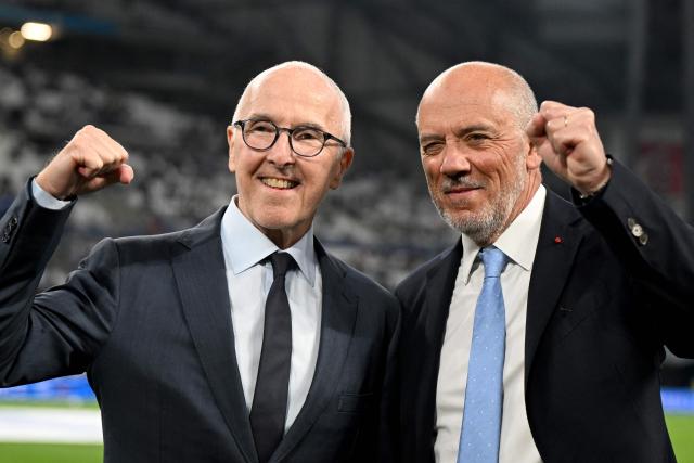 Marseille's newly appointed President Stephane Richard (R) and Marseille's US owner Frank McCourt pose prior the French L1 football match between Olympique de Marseille (OM) and FC Metz at the Stade Velodrome in Marseille, southern France, on April 10, 2026. (Photo by Gabriel BOUYS / AFP)