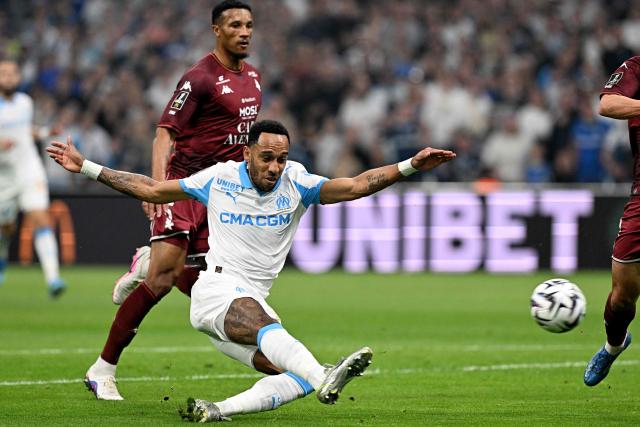 Marseille's Gabonese forward #17 Pierre-Emerick Aubameyang scores a goal during the French L1 football match between Olympique de Marseille (OM) and Metz FC at the Stade Velodrome in Marseille, southern France on April 10, 2026. (Photo by Gabriel BOUYS / AFP)