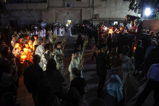 People attend Good Friday mass at the Greek Orthodox church of Saing Porphyrius in Gaza City on April 10, 2026. (Photo by Omar AL-QATTAA / AFP)