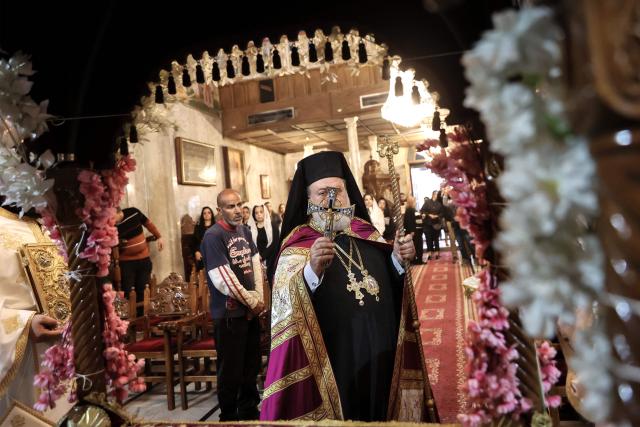 Archbishop Alexios leads Good Friday mass at the Greek Orthodox church of Saing Porphyrius in Gaza City on April 10, 2026. (Photo by Omar AL-QATTAA / AFP)