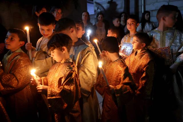People attend Good Friday mass at the Greek Orthodox church of Saing Porphyrius in Gaza City on April 10, 2026. (Photo by Omar AL-QATTAA / AFP)
