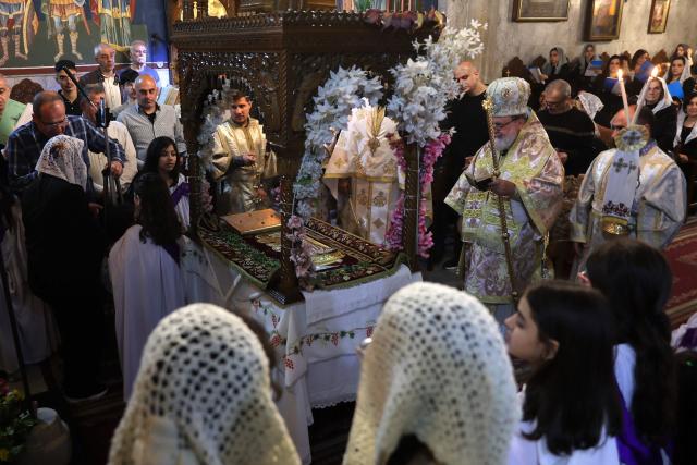 Archbishop Alexios (2nd-R) leads Good Friday mass at the Greek Orthodox church of Saing Porphyrius in Gaza City on April 10, 2026. (Photo by Omar AL-QATTAA / AFP)