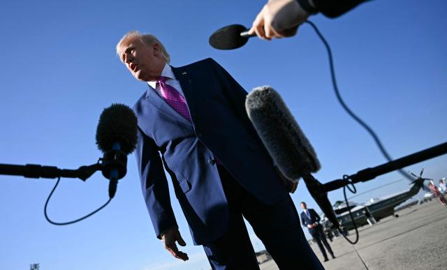 US President Donald Trump speaks to journalists before boarding Air Force One at Joint Base Andrews, Maryland on April 10, 2026. President Trump is flying to Charlottesville, Virginia to attend a MAGA inc. meeting and dinner at Trump Winery. (Photo by Jim WATSON / AFP)