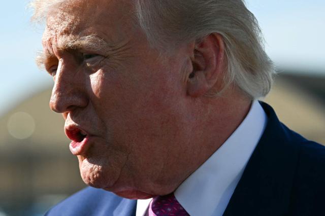US President Donald Trump speaks to journalists before boarding Air Force One at Joint Base Andrews, Maryland on April 10, 2026. President Trump is flying to Charlottesville, Virginia to attend a MAGA inc. meeting and dinner at Trump Winery. (Photo by Jim WATSON / AFP)