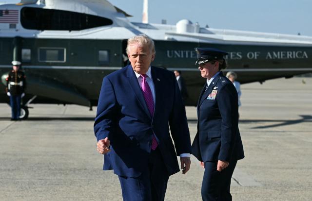 US President Donald Trump dissembark Marine One at Joint Base Andrews, Maryland on April 10, 2026. President Trump is flying to Charlottesville, Virginia to attend a MAGA inc. meeting and dinner at Trump Winery. (Photo by Jim WATSON / AFP)