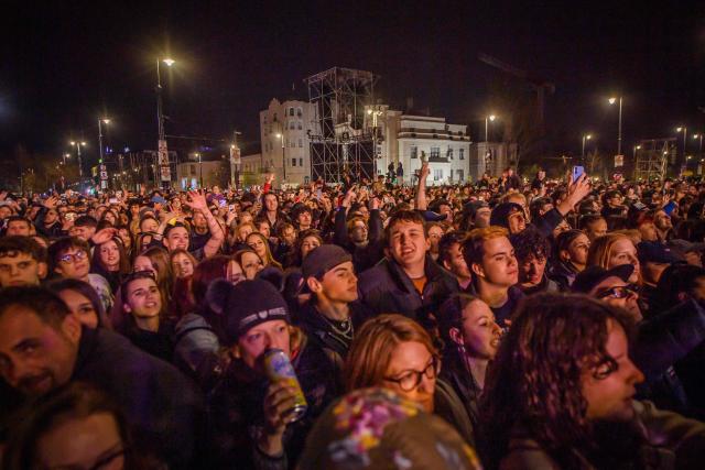 People attend the so-called concert ‘Rendszerbonto’ (“Demolition of the System”), which features more than 40 artists and is organized by the citizen resistance movement on Heroes’ Square in Budapest on April 10, 2026, two days before general elections. (Photo by Ferenc ISZA / AFP)