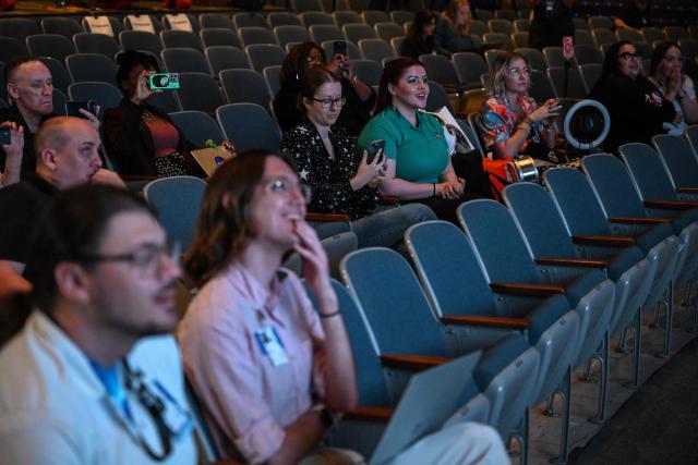 Journalist watch the splash down of the Artemis II crew at Johnson Space Center in Houston, Texas, on April 10, 2026. The NASA spacecraft that carried four astronauts around the Moon splashed down as planned Friday into the Pacific Ocean. The crew members -- Christina Koch, Victor Glover, Jeremy Hansen and Reid Wiseman -- are to be met by recovery teams and flown to a US military ship for medical evaluations. (Photo by RONALDO SCHEMIDT / AFP)