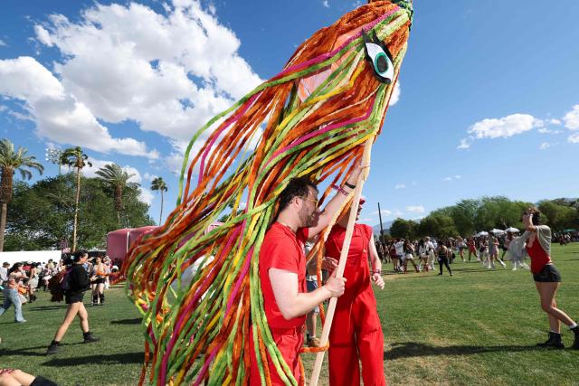 A puppeteer from the Bob Baker Marionette Theater walks with a puppet during the 2026 Coachella Valley Music and Arts Festival in Indio, California on April 10, 2026. (Photo by VALERIE MACON / AFP)