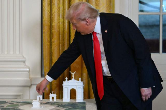 (FILES) US President Donald Trump stands near models for a proposed "Independence Arch" as he speaks during a dinner with ballroom donors in the East Room of the White House in Washington, DC on October 15, 2025. The Trump administration unveiled plans on April 10, 2026 for a grand arch it intends to build in Washington, a new project by the American president designed to leave his mark on the US capital. "I am pleased to announce that TODAY my Administration officially filed the presentation and plans to the highly respected Commission of Fine Arts for what will be the GREATEST and MOST BEAUTIFUL Triumphal Arch, anywhere in the World," Trump wrote on his Truth Social platform. (Photo by ANDREW CABALLERO-REYNOLDS / AFP)
