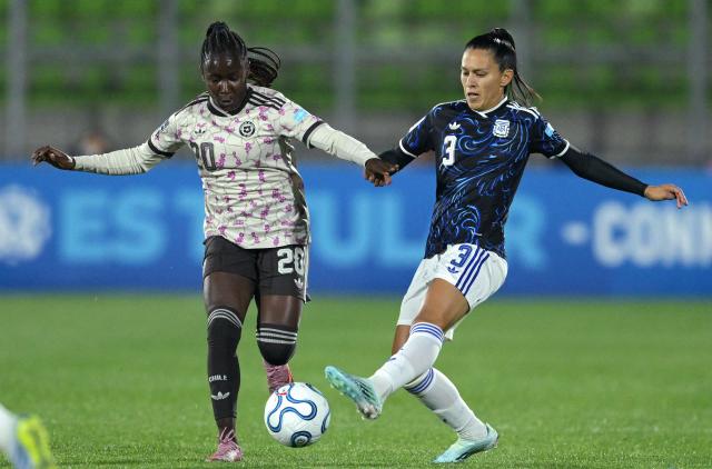 Chile's midfielder #20 Mary Valencia and Argentina's defender #03 Eliana Stabile fight for the ball during the CONMEBOL Nations League Women football match between Chile and Argentina at the Elias Figueroa stadium in Valparaiso, Chile on April 10, 2026. (Photo by Rodrigo ARANGUA / AFP)
