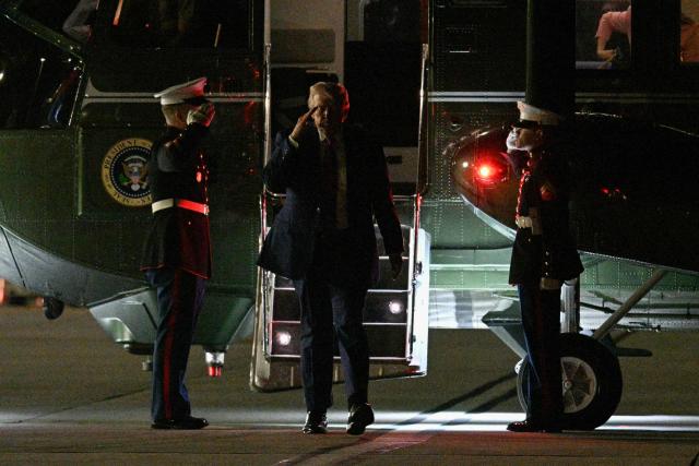 US President Donald Trump salutes after stepping off of Marine One before boarding Air Force One en route to the White House, at Charlottesville-Albemarle Airport in Charlottesville, Virginia on April 10, 2026. President Trump was in Charlottesville, Virginia to attend a MAGA inc. meeting and dinner at the Trump Winery. (Photo by Jim WATSON / AFP)