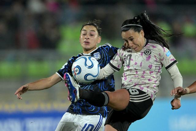 Argentina's midfielder #10 Maricel Pereyra and Chile's defender #18 Camila Saez fight for the ball during the CONMEBOL Nations League Women football match between Chile and Argentina at the Elias Figueroa stadium in Valparaiso, Chile on April 10, 2026. (Photo by Rodrigo ARANGUA / AFP)