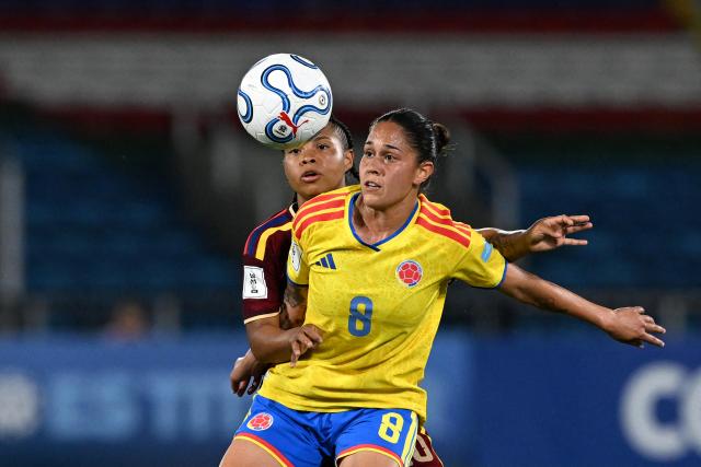 Venezuela's midfielder #20 Dayana Rodriguez and Colombia's midfielder #08 Marcela Restrepo fight for the ball during the CONMEBOL Nations League Women football match between Colombia and Venezuela at the Olímpico Pascual Guerrero stadium in Cali, Valle del Cauca, Colombia, on April 10, 2026. (Photo by JOAQUIN SARMIENTO / AFP)