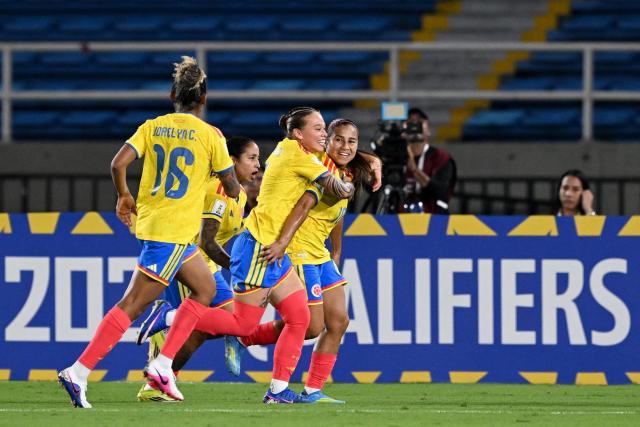 Colombia's midfielder #10 Leicy Santos (R) celebrates with teammates after scoring the equalising goal from the penalty spot during the CONMEBOL Nations League Women football match between Colombia and Venezuela at the Olímpico Pascual Guerrero stadium in Cali, Valle del Cauca, Colombia, on April 10, 2026. (Photo by JOAQUIN SARMIENTO / AFP)