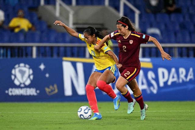 Colombia's midfielder #19 Maithe Lopez and Venezuela's defender #02 Veronica Herrera fight for the ball during the CONMEBOL Nations League Women football match between Colombia and Venezuela at the Olímpico Pascual Guerrero stadium in Cali, Valle del Cauca, Colombia, on April 10, 2026. (Photo by JOAQUIN SARMIENTO / AFP)