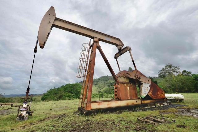 A Pemex pumpjack is pictured in Arroyo Florido, Veracruz state, Mexico on April 10, 2026. The Mexican government plans to extract natural gas using hydraulic fracturing, a method that has been criticized by environmental organizations, in order to reduce its dependence on imports from the United States, according to a plan presented by President Claudia Sheinbaum on April 9, 2026. (Photo by Marco Antonio MARTINEZ / AFP)