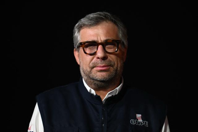 Peru's National Office of Electoral Processes (ONPE) chief Piero Corvetto poses for a photo after a press conference while loading voting materials onto trucks at ONPE facilities in Lima on April 10, 2026. Peru will hold presidential elections on April 12. (Photo by Luis ROBAYO / AFP)