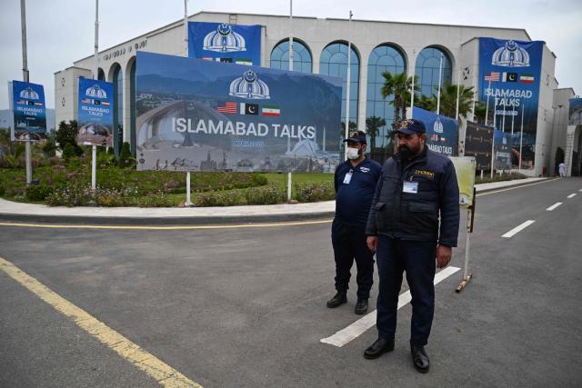 Private security personnel stand at the media centre ahead of US–Iran peace talks in Islamabad on April 11, 2026. US Vice President JD Vance was en route to Islamabad on April 11 for talks with Iran that the Pakistani premier hosting the warring sides called a "make or break" effort to permanently halt weeks of fighting in the Middle East. (Photo by Aamir QURESHI / AFP)