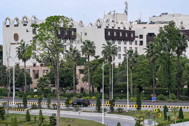 Army personnel ride past Serena Hotel at the Red Zone area ahead of US–Iran peace talks in Islamabad on April 11, 2026. Iran and the United States were scheduled to hold peace talks in Pakistan on April 11 with the foes appearing to be far apart on key demands and expressing mutual mistrust. (Photo by Aamir QURESHI / AFP)