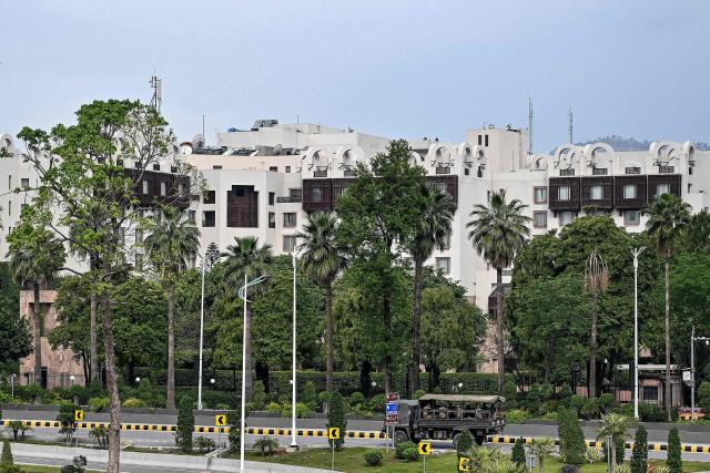 Army personnel patrol near the Serena Hotel, the expected venue for the US–Iran peace talks, at the Red Zone area in Islamabad on April 11, 2026. Iran and the United States were scheduled to hold peace talks in Pakistan on April 11 with the foes appearing to be far apart on key demands and expressing mutual mistrust. (Photo by Aamir QURESHI / AFP)