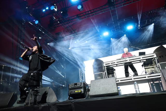 DJ Matsunaga and R-Shitei (L) from Japanese hip-hop duo Creepy Nuts perform on the Gobi stage during the 2026 Coachella Valley Music and Arts Festival in Indio, California on April 10, 2026. (Photo by VALERIE MACON / AFP)