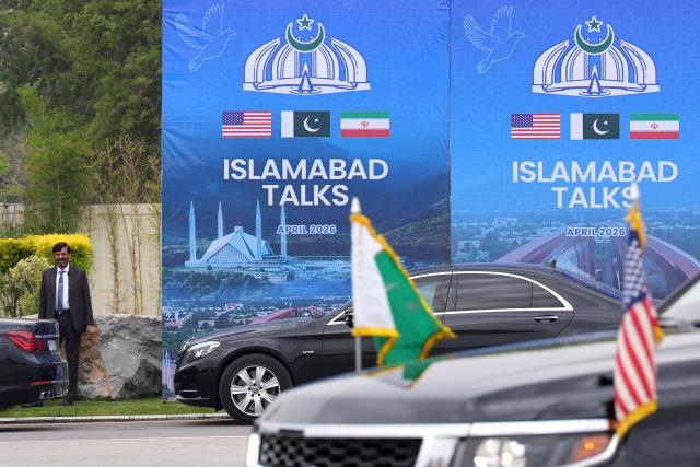 A Pakistani official is pictured during the arrival of the US Vice President JD Vance for US-Iran peace talks in Islamabad on April 11, 2026. US Vice President JD Vance arrived in Islamabad on April 11 for talks with Iran that the Pakistani premier hosting the warring sides called a "make or break" effort to permanently halt weeks of fighting in the Middle East. (Photo by Jacquelyn MARTIN / POOL / AFP)