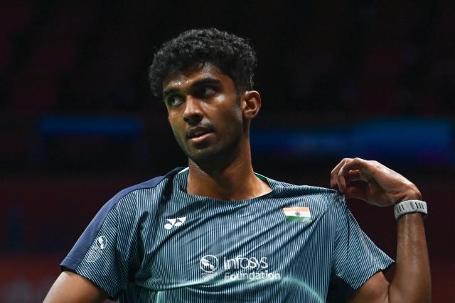 India's Ayush Shetty reacts during the men's singles semifinal match against Thailand's Kunlavut Vitidsarn at the Badminton Asia Championship in Ningbo, eastern China's Zhejiang province on April 11, 2026. (Photo by CN-STR / AFP) / China OUT