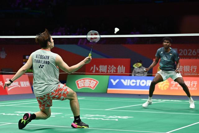 Thailand's Kunlavut Vitidsarn hits a return to India's Ayush Shetty during their men's singles semifinal match at the Badminton Asia Championship in Ningbo, eastern China's Zhejiang province on April 11, 2026. (Photo by CN-STR / AFP) / China OUT