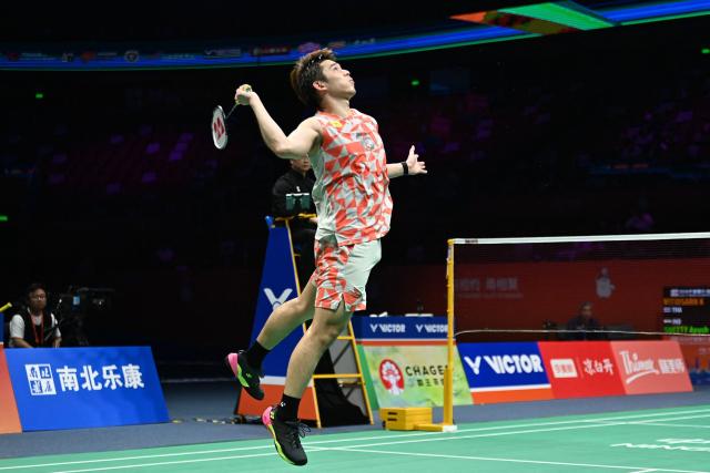 Thailand's Kunlavut Vitidsarn hits a return to India's Ayush Shetty during their men's singles semifinal match at the Badminton Asia Championship in Ningbo, eastern China's Zhejiang province on April 11, 2026. (Photo by CN-STR / AFP) / China OUT