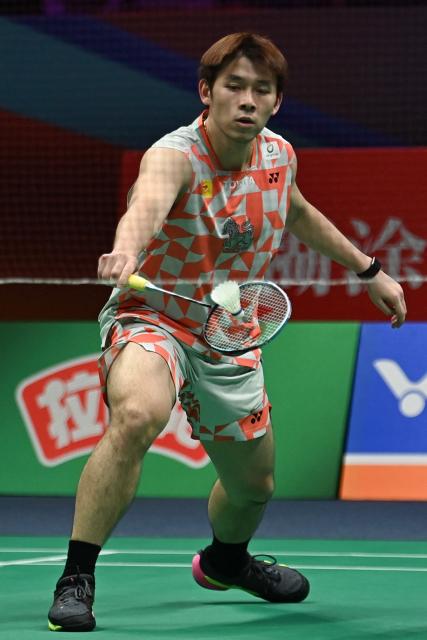 Thailand's Kunlavut Vitidsarn hits a return to India's Ayush Shetty during their men's singles semifinal match at the Badminton Asia Championship in Ningbo, eastern China's Zhejiang province on April 11, 2026. (Photo by CN-STR / AFP) / China OUT